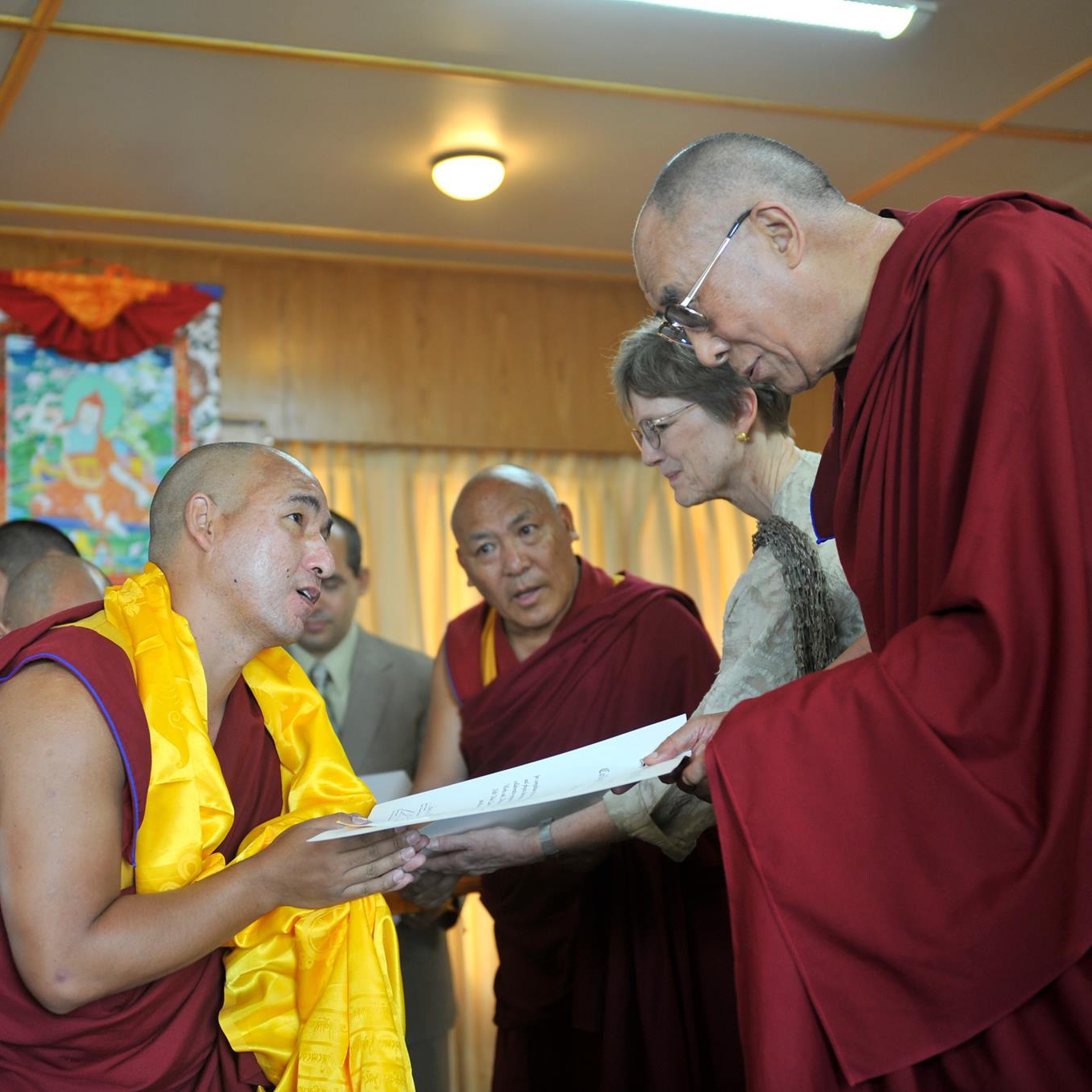 Shelnang Mugum receiving recognition from His Holiness the Dalai Lama