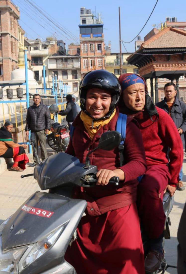 Shelnang Mugum navigating daily life in Kathmandu with a fellow monk